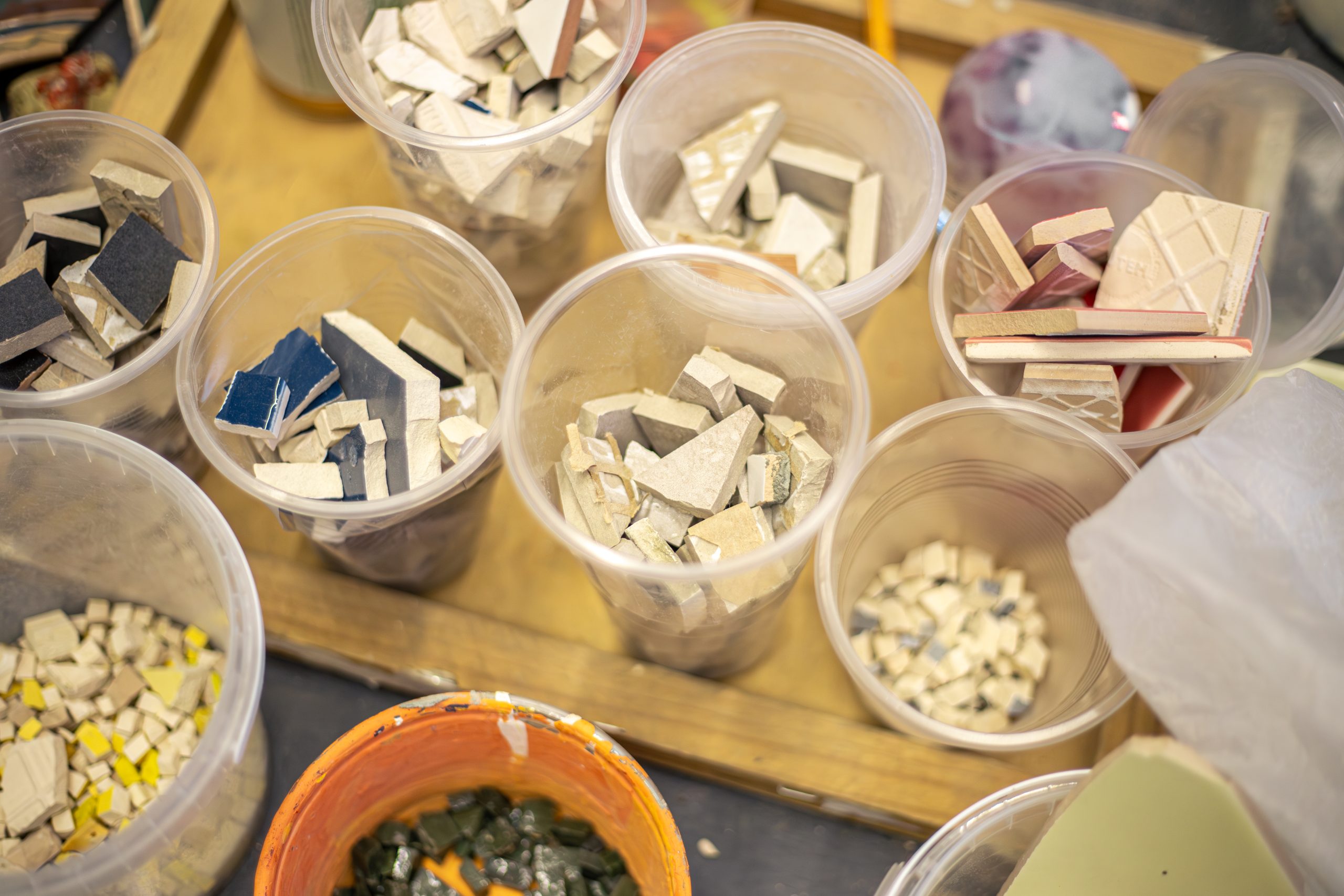 Colorful mosaic tiles. Prepackaged mosaic tiles. High quality photo. The process of creating a mosaic. Pieces of mosaic tiles in an art workshop.