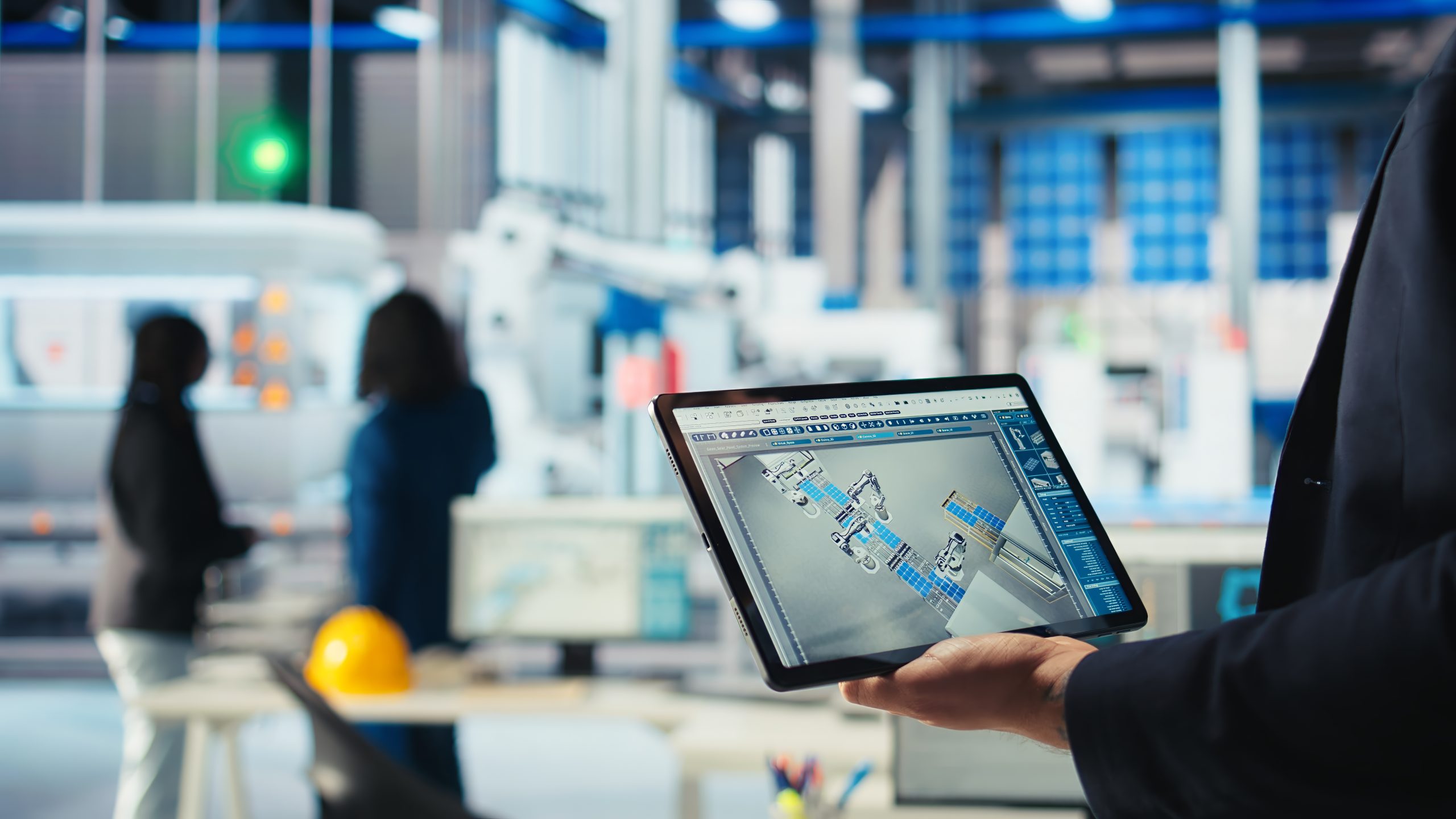 Engineer in photovoltaics factory uses tracking software on tablet to review performance of robot arms manufacturing solar panels. Expert uses device to inspect solar plant machinery, camera A closeup