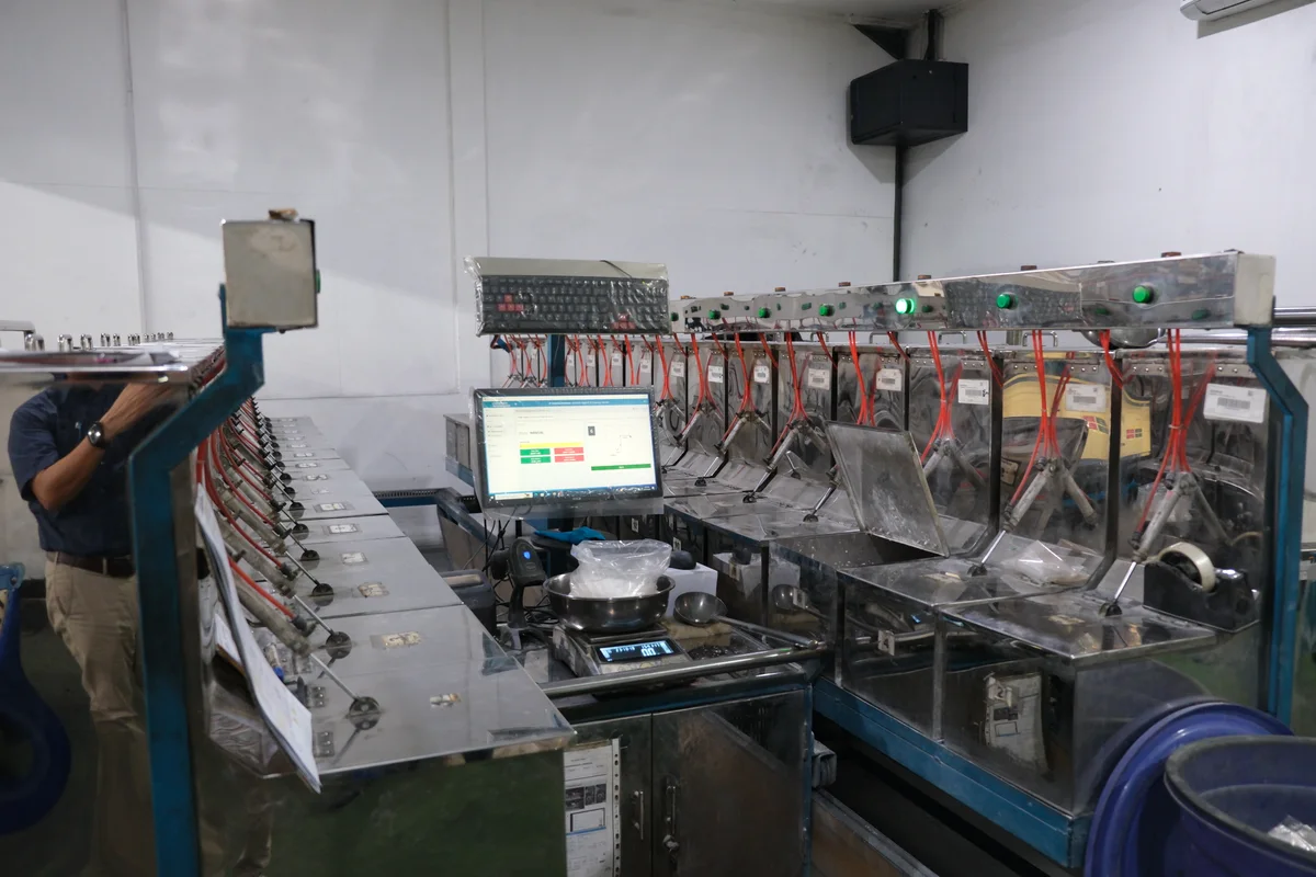 Operator monitoring a rubber production line
